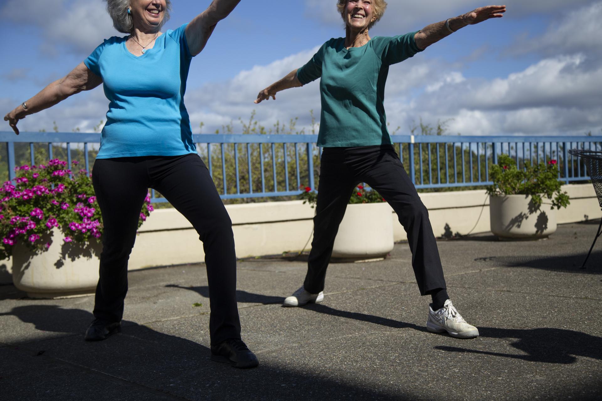 Two women lifting weights