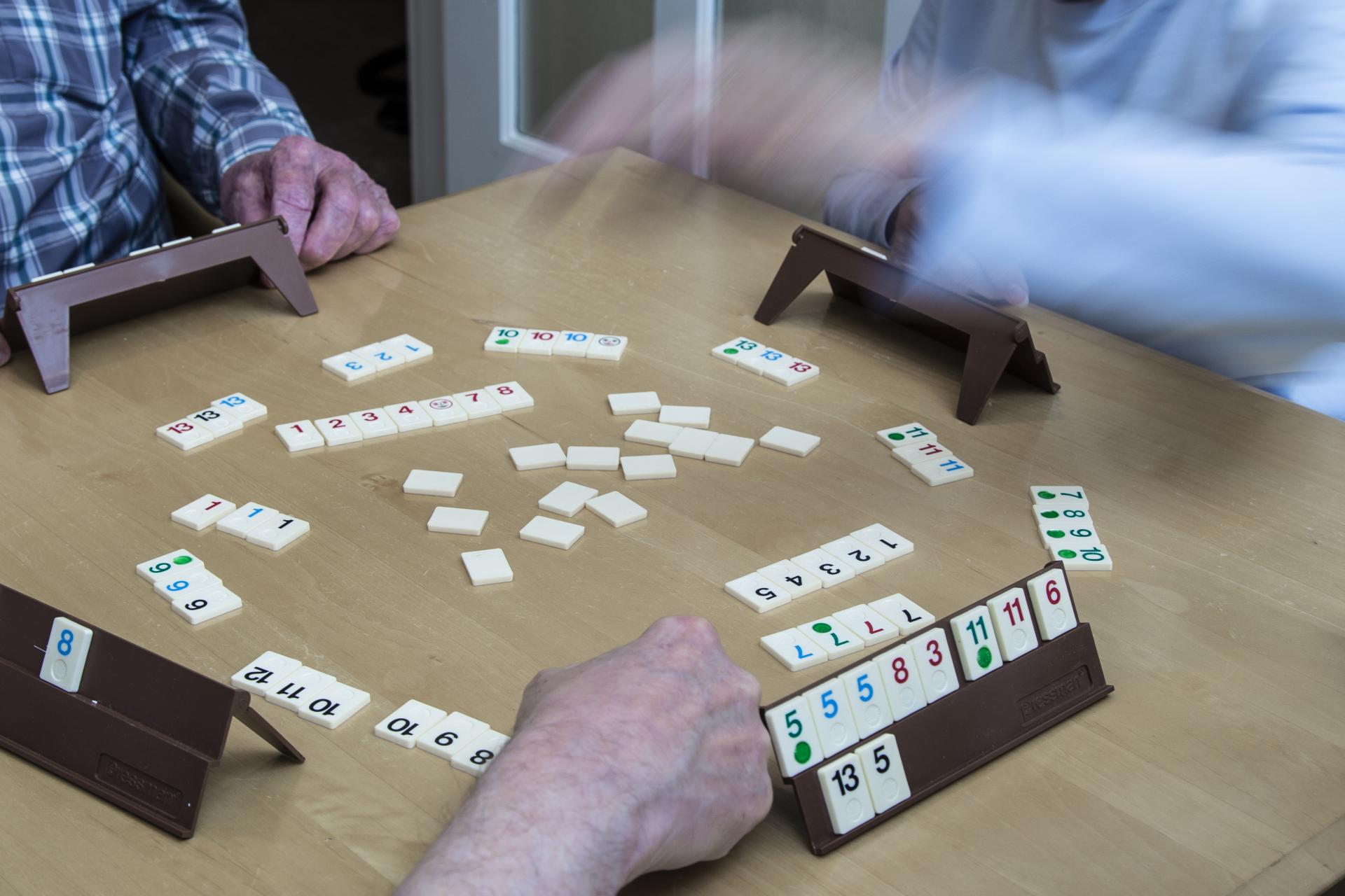 People playing game at table